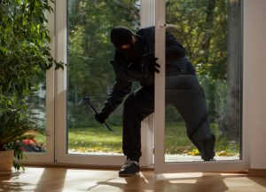 Burglar entering through the balcony window